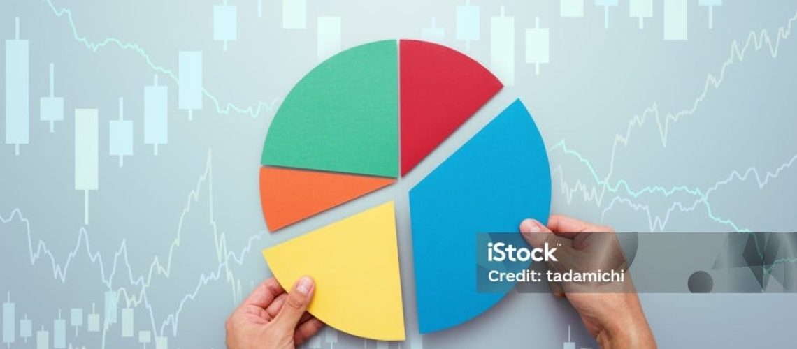 Investor managing portfolio. Pie chart and candlestick charts.
